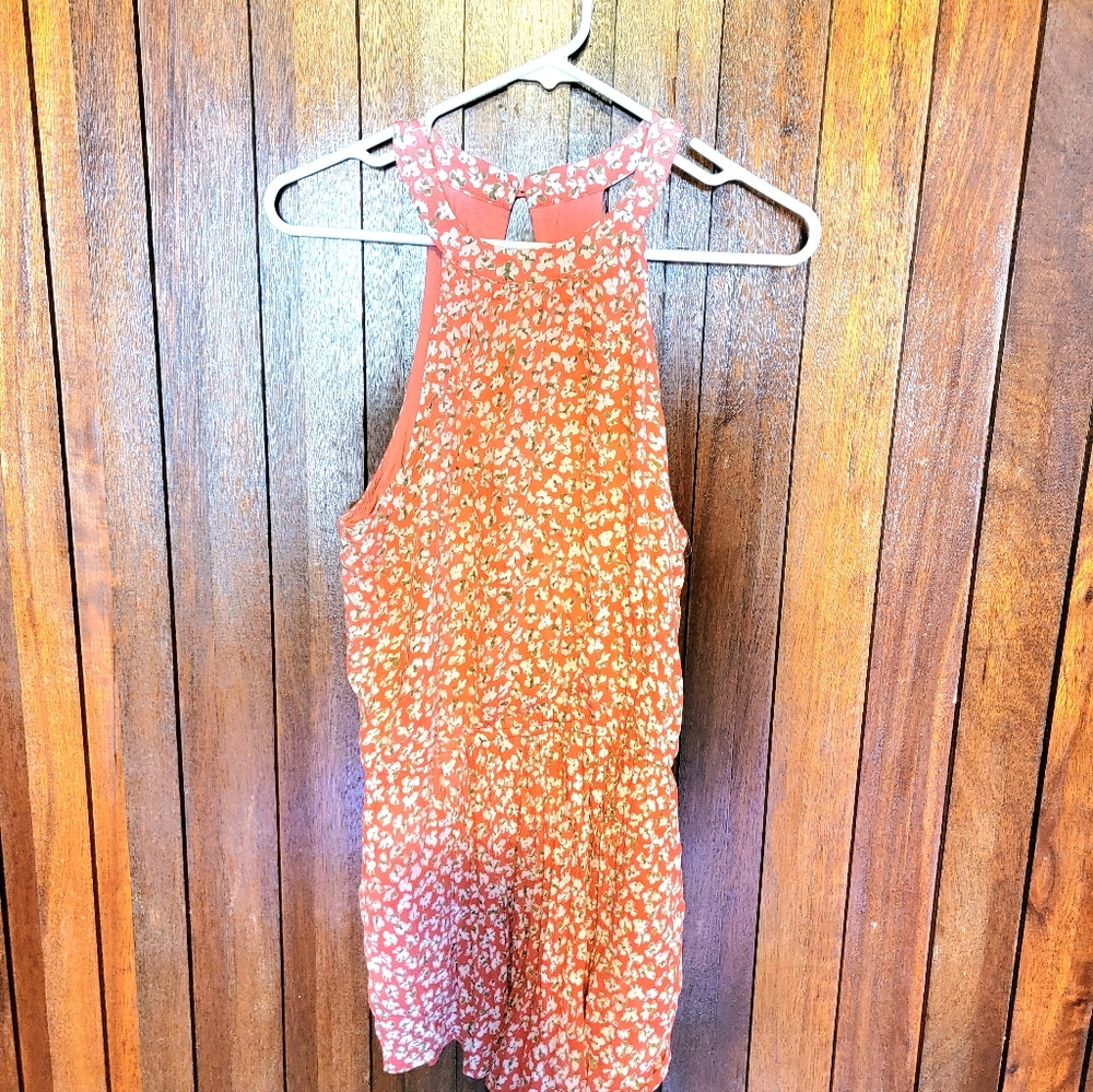 Womens romper,size medium,pinkish orange color with flower print